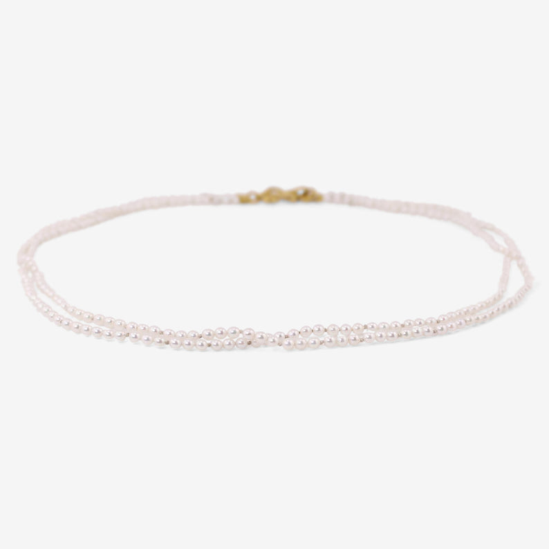 DENISE BETESH 22K & JAPANESE AKOYA PEARL DOUBLE STRAND NECKLACE.