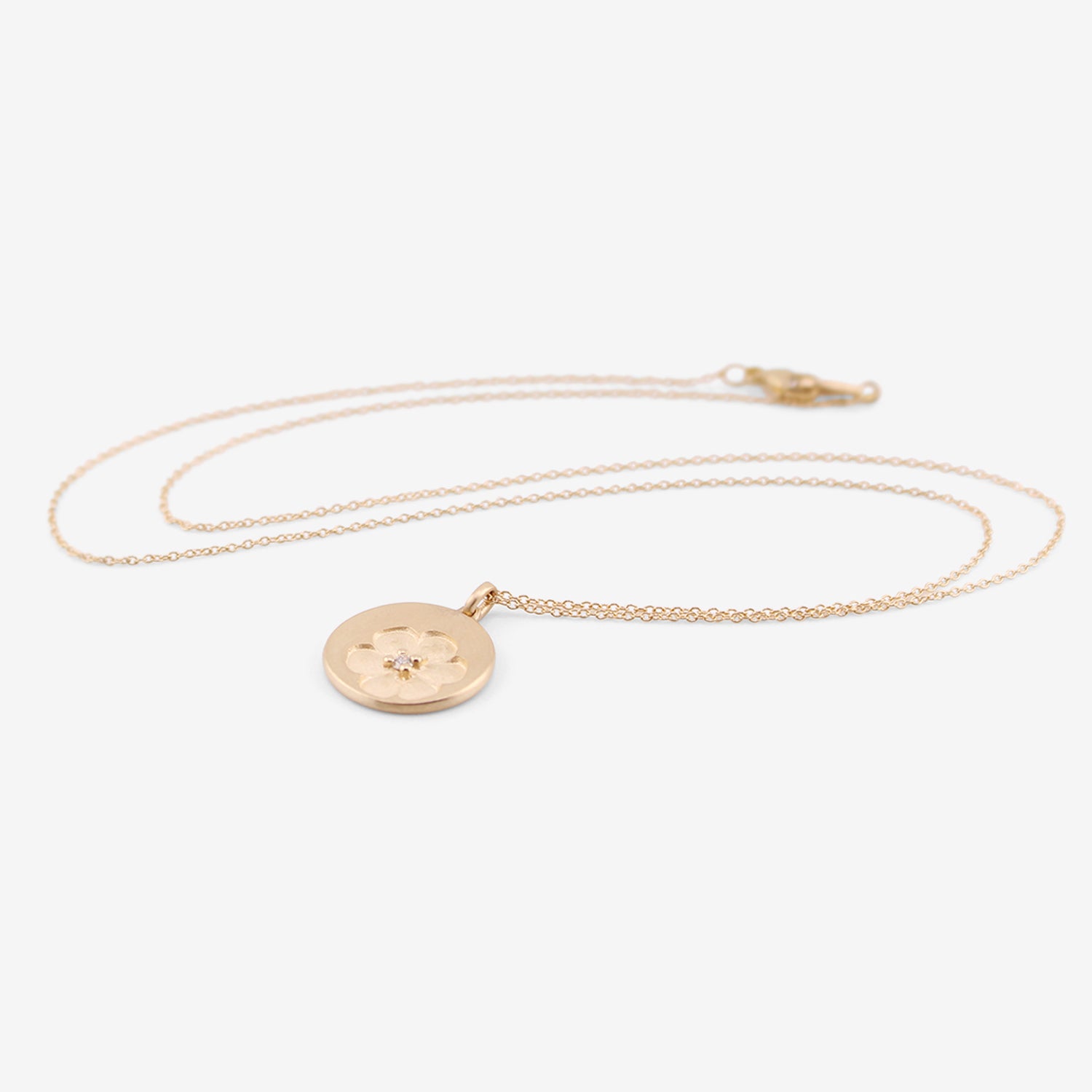 NICOLE LANDAW 14K & DIAMOND FLOWER STAMP DISC PENDANT, .03CT