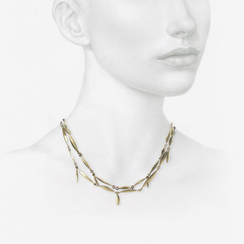 TED MUEHLING 10K APPLESEED NECKLACE