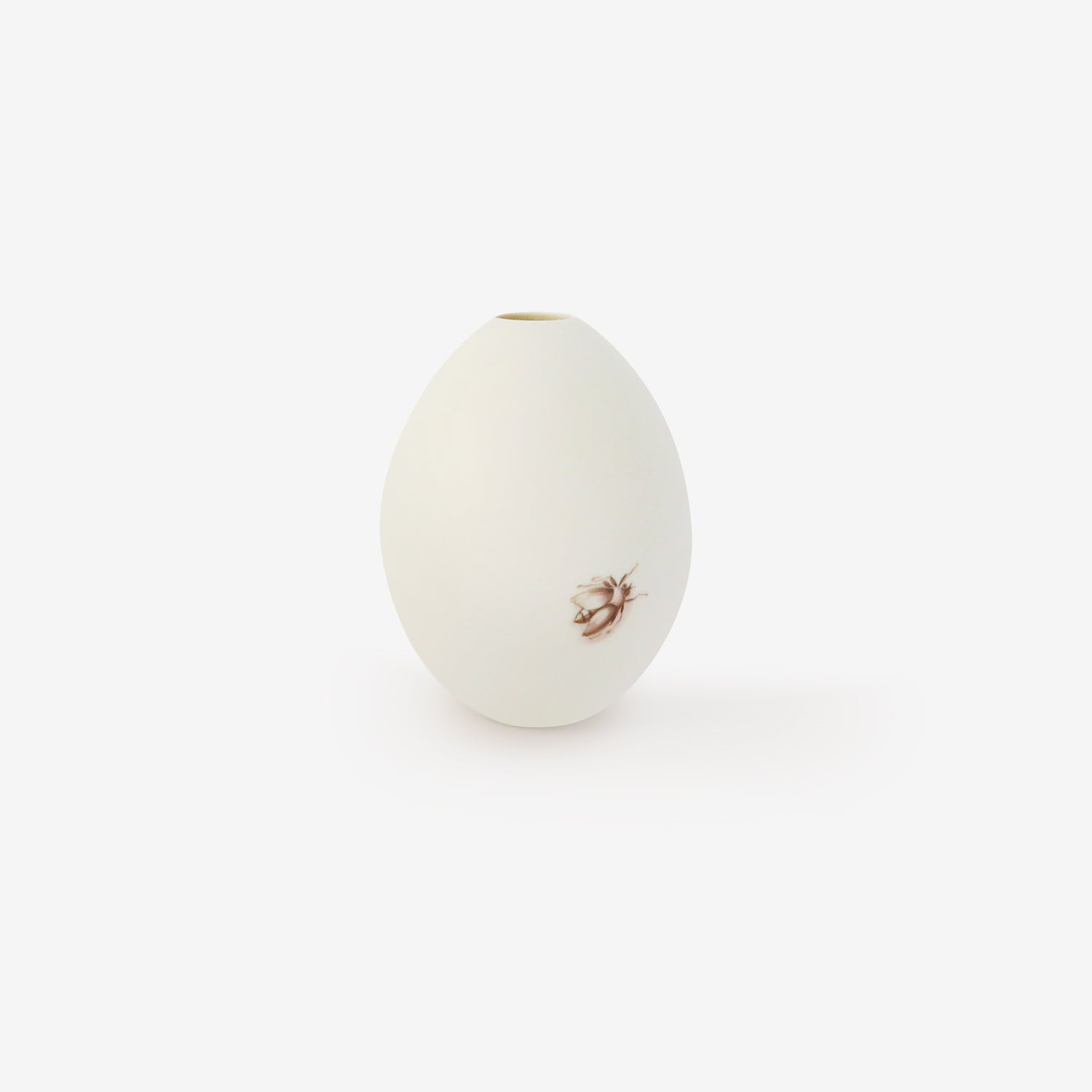 TED MUEHLING SMALL WHITE BISQUE GOOSE EGG VASE WITH PAINTED FLY