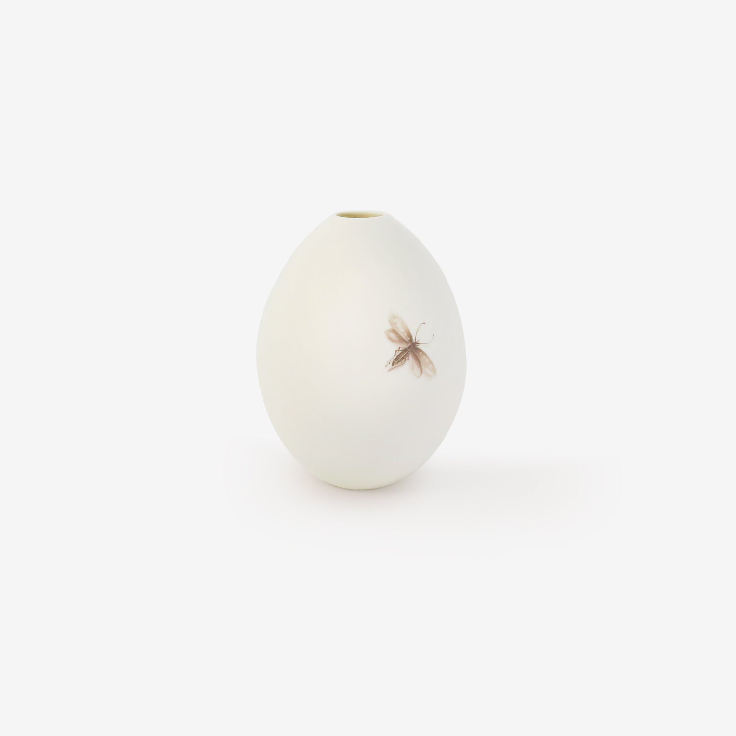 TED MUEHLING SMALL WHITE BISQUE GOOSE EGG VASE WITH PAINTED MOTH